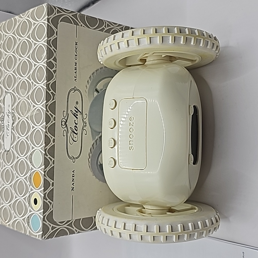 Clocky alarm on set of wheels rolls around gets child out of bed to shut off - Picture 2 of 6